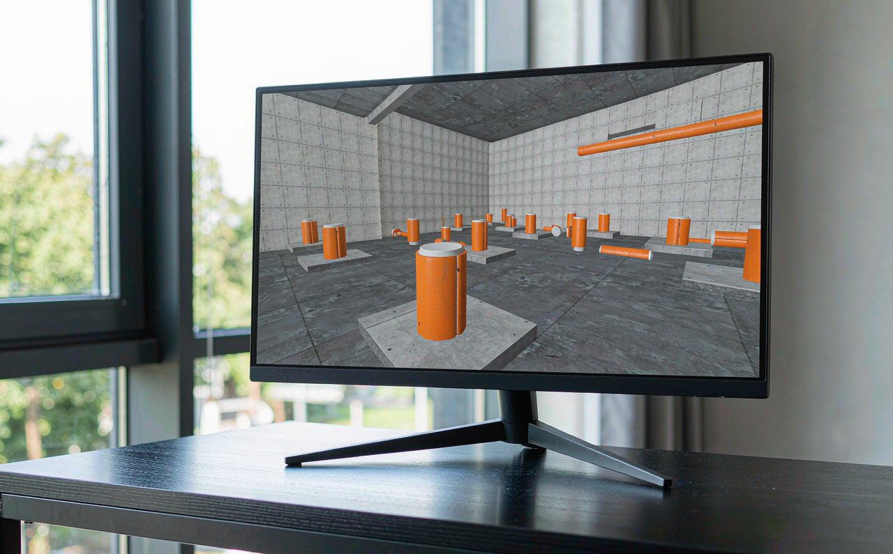A widescreen gaming monitor displaying a generic first-person shooter training range